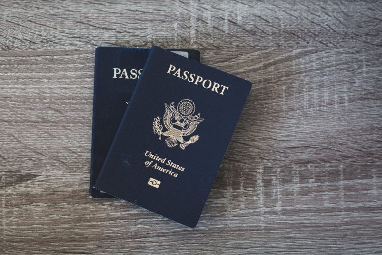 A passport and travel documents on a desk